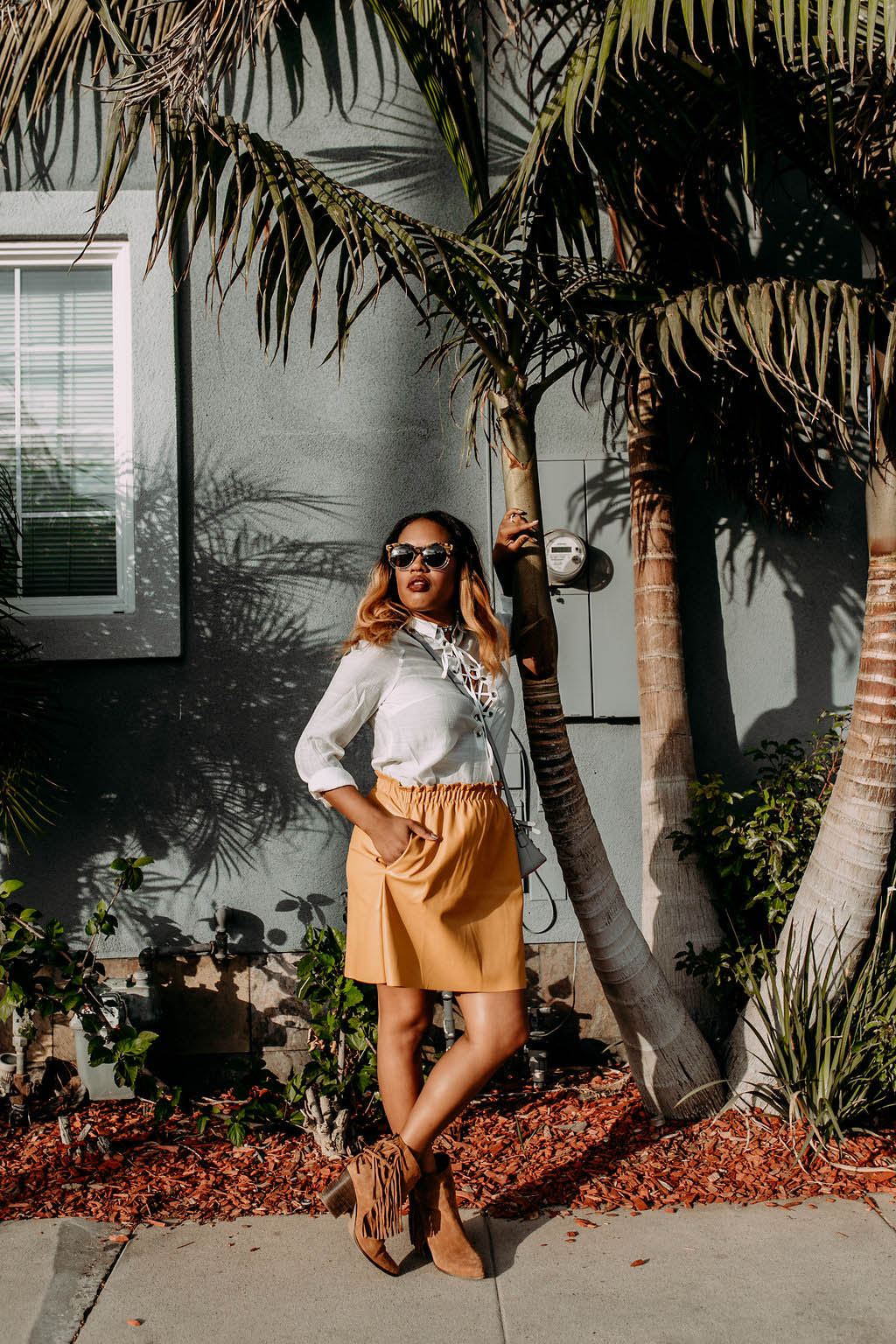 Laced Up Blouse + Leather Mini Skirt -- https://thehautemommie.com/all-laced-up/